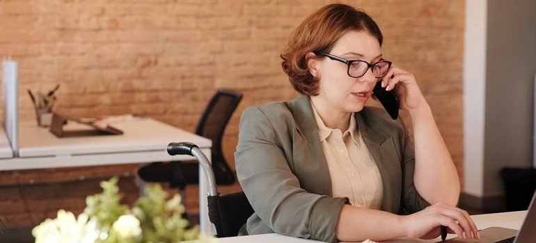 Woman on phone checking if insurance can cover substance use disorder.