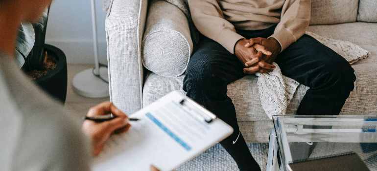 A man and a woman in a therapy session at Florida prescription drugs addiction treatment center