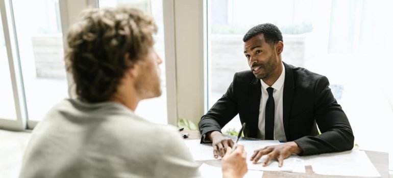 A person consulting with an insurance agent about partial hospitalization