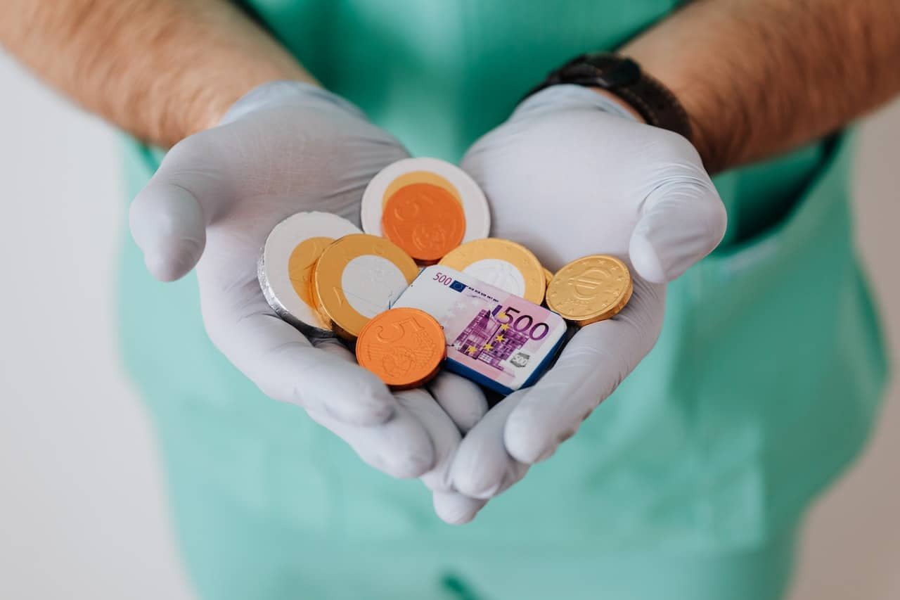 a doctor holding fake money