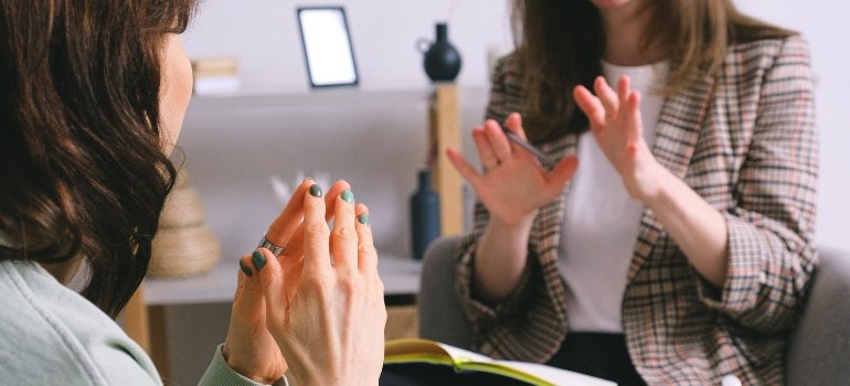 two people talking about the power of personal rehab testimonials in Boynton Beach