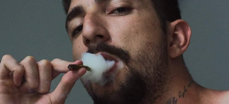 A man smoking a cigarette