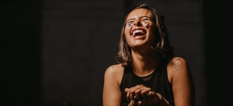 A young woman laughing hysterically