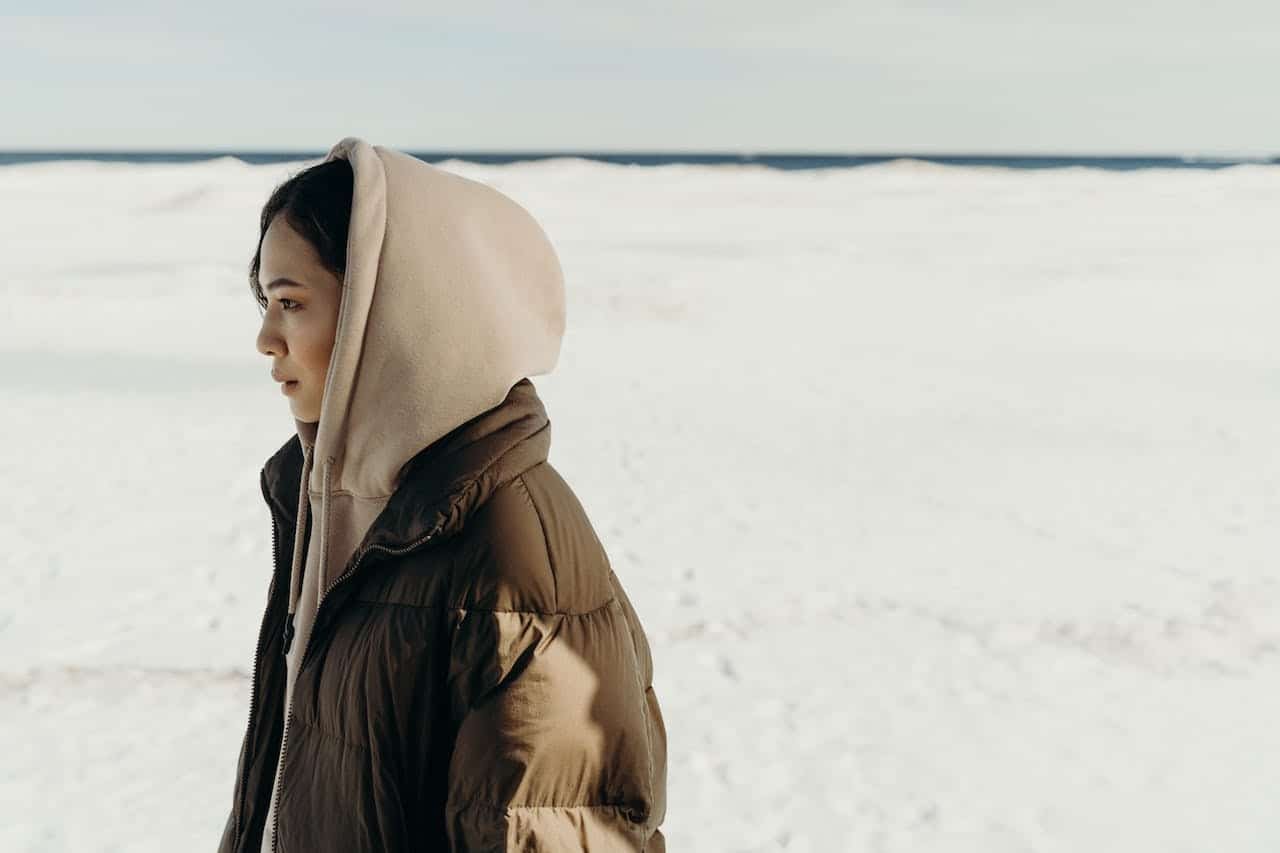 A person experiencing the challenges of winter blues and addiction