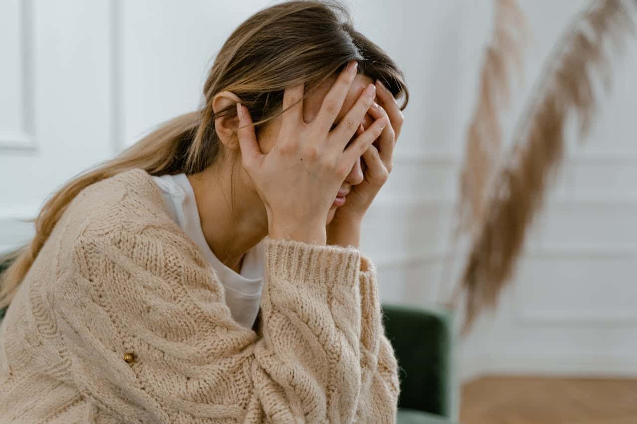 Woman sitting feeling sad