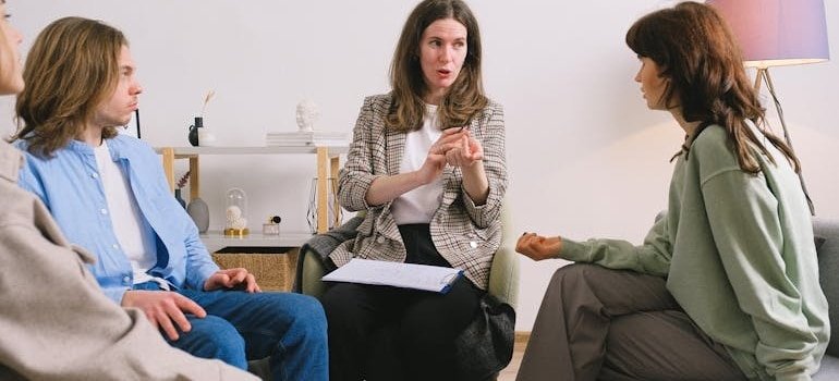 Psychiatrist talking to a group of people.