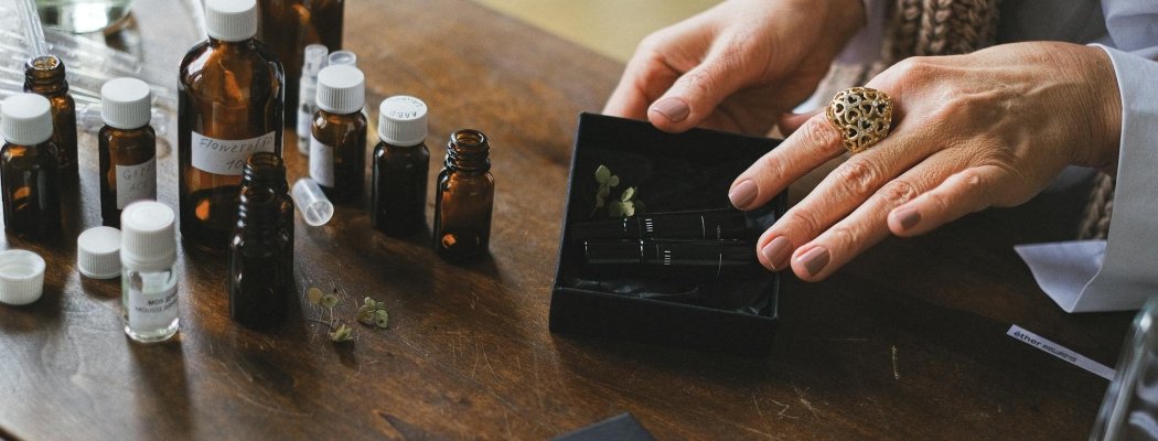 a woman looking at her medicine bottles