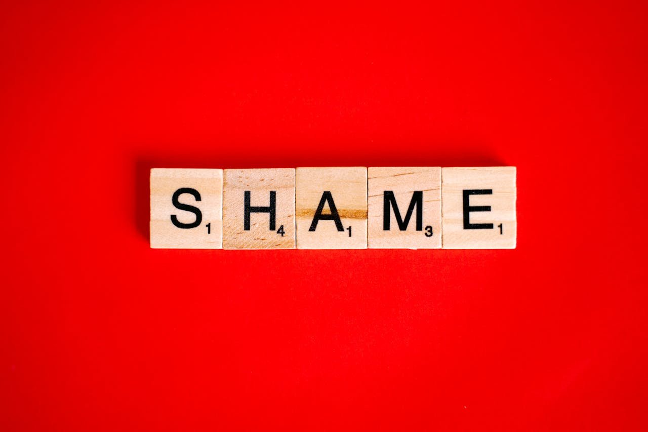 Shame spelled with Scrabble letters