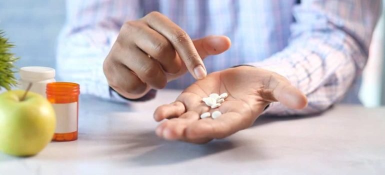 Man Pointing On Drugs On His Hand