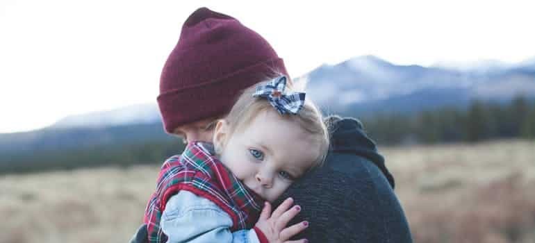 man holding a little girl