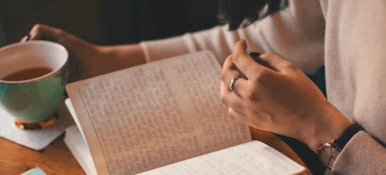 a person writing in journal