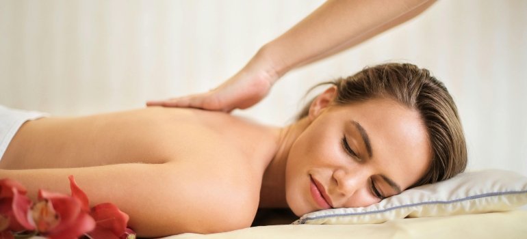 A woman getting a massage to stay motivated on the recovery journey