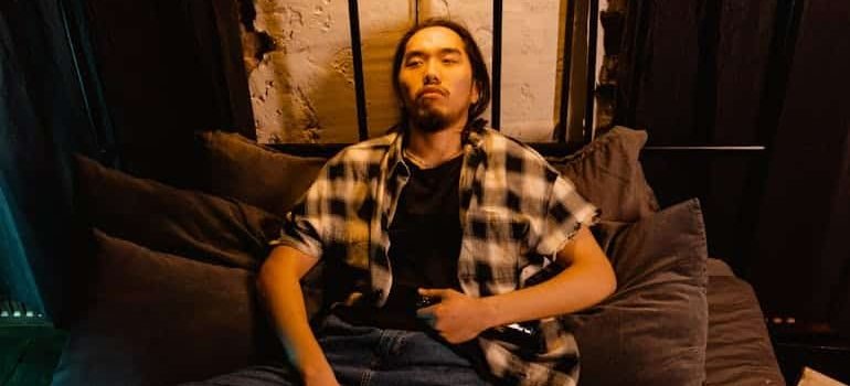 man lying on a couch wondering how long does molly last