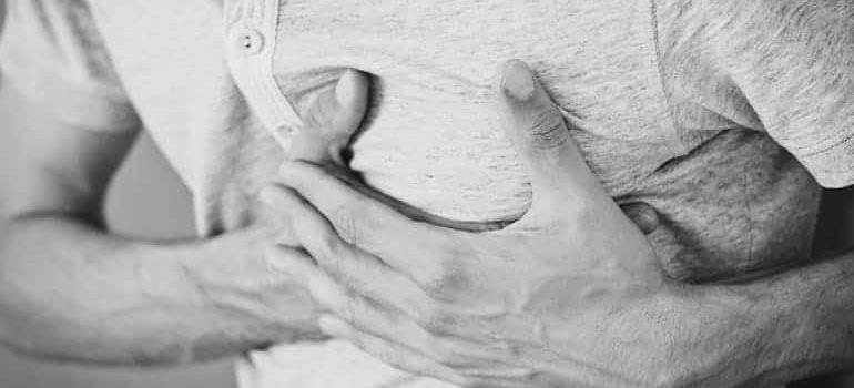 a man holding his chest